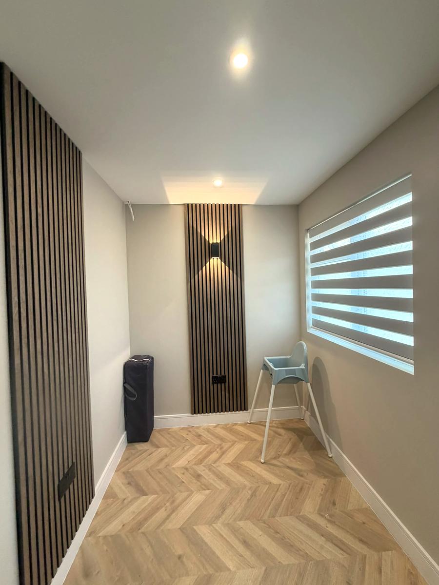 Panelled family room with a white day and night blind