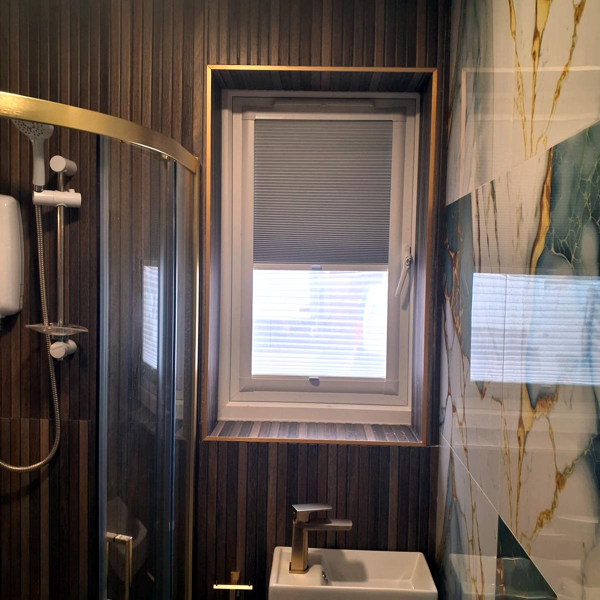 Pleated blind fitted to a shower room window